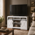 color:white | White 58-inch farmhouse TV stand with sliding barn doors and open storage in a living room